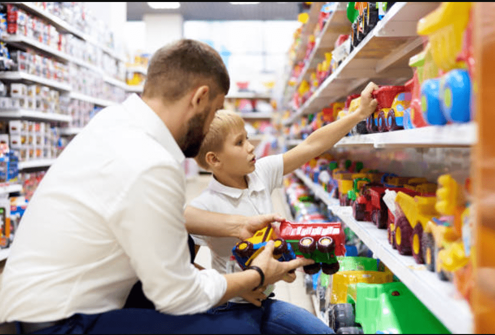 Branded variety store interior with shelves of diverse products, including home goods, electronics, and clothing.
