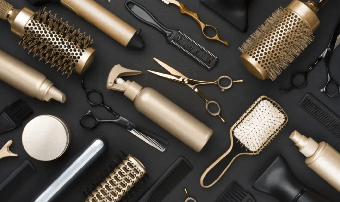 comb brush scissor dryer gold and black background