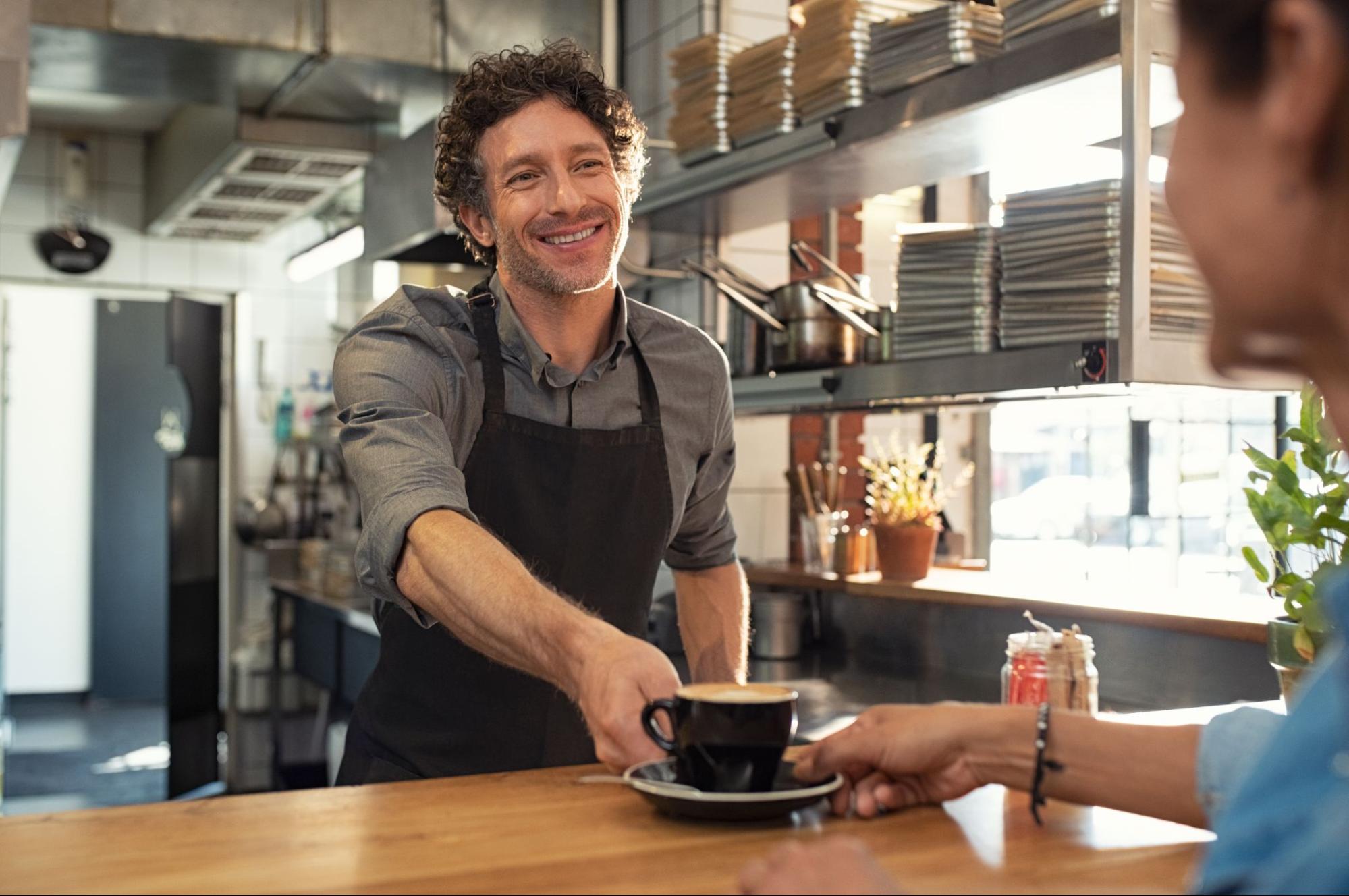 Person handing an order to the customer