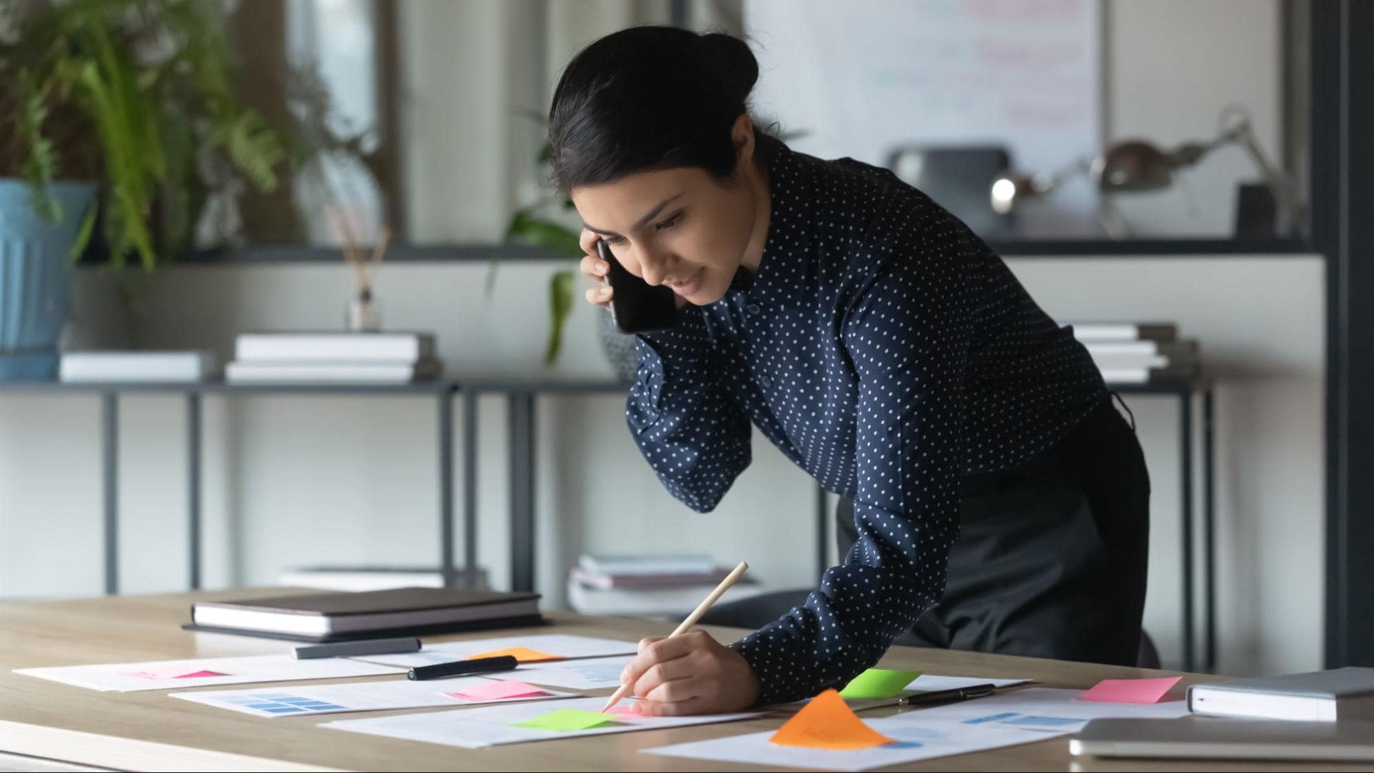 A business broker talking with client on phone