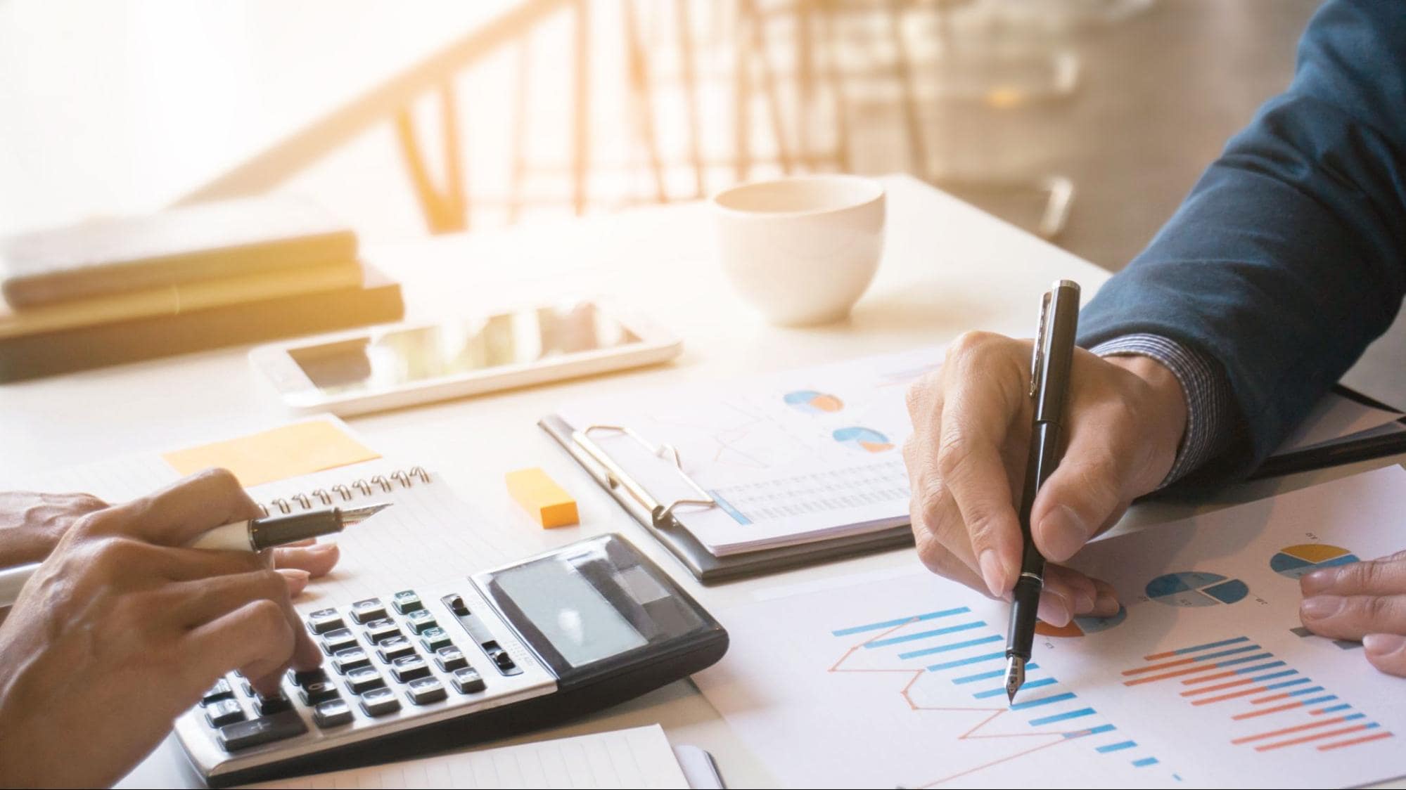 Accountants working on bar graph