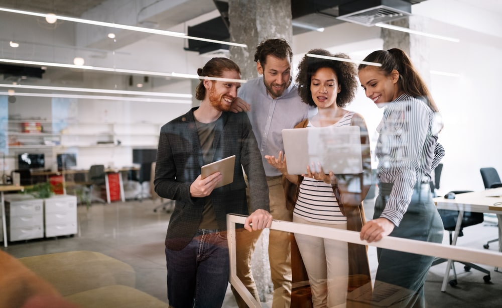 Employees looking at a laptop