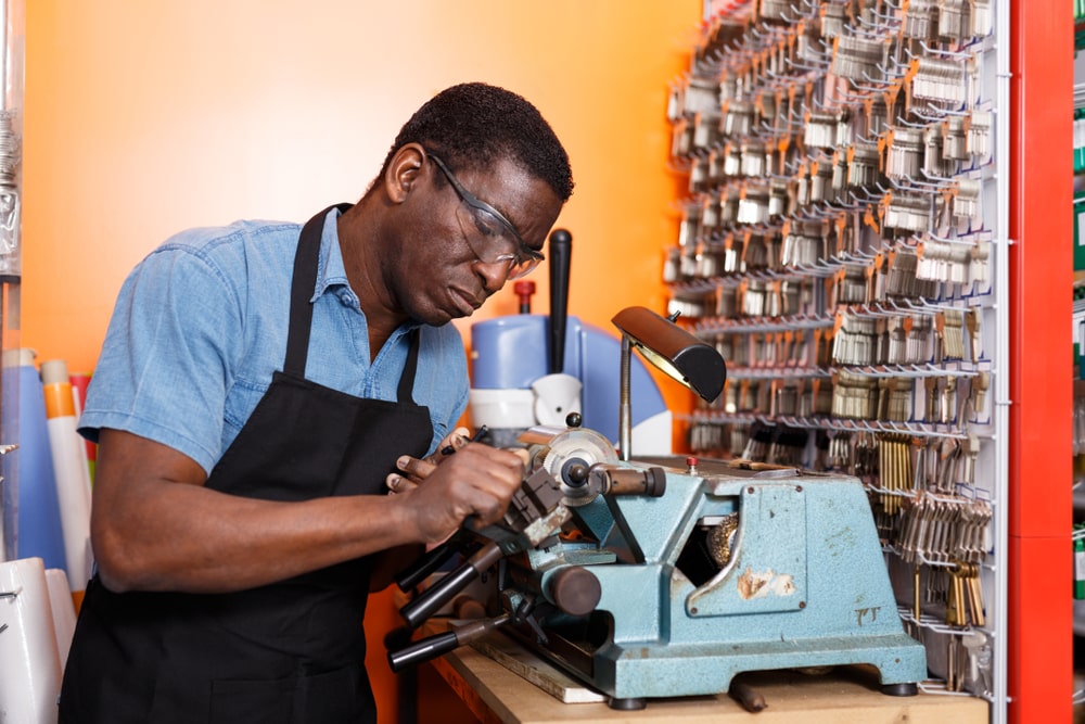 Locksmith working on a key