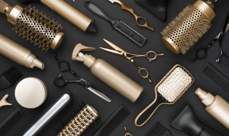comb brush scissor dryer gold and black background